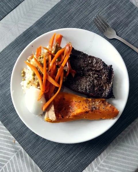 Home-cooked steak, rice, vegetables and squash